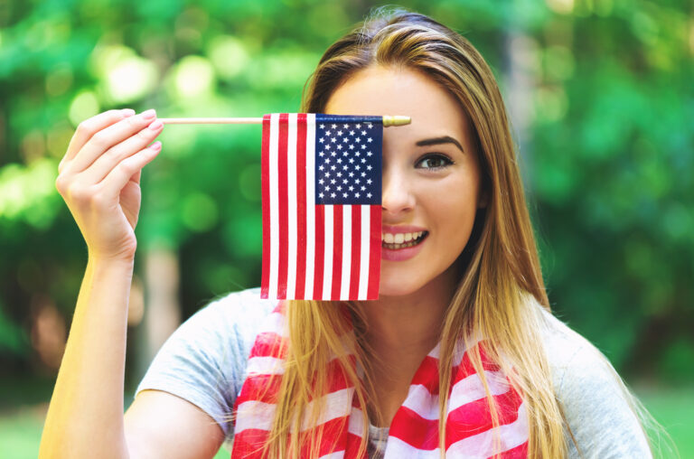 GIrl with an American flag on the fourth of July