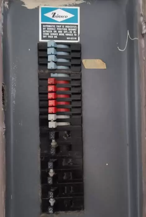Old zinsco electrical panel with open door